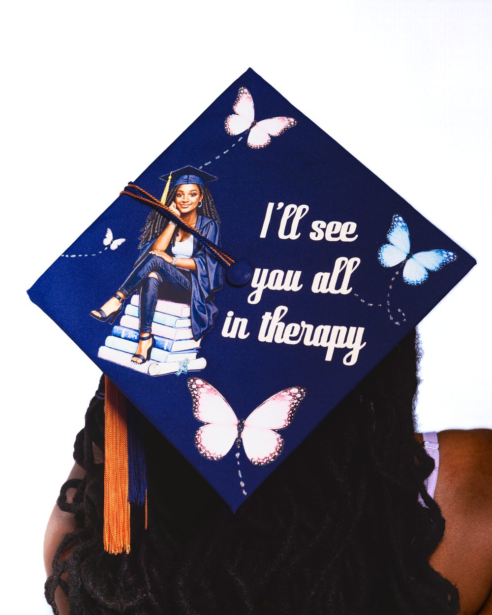 Custom graduation cap detail with butterflies