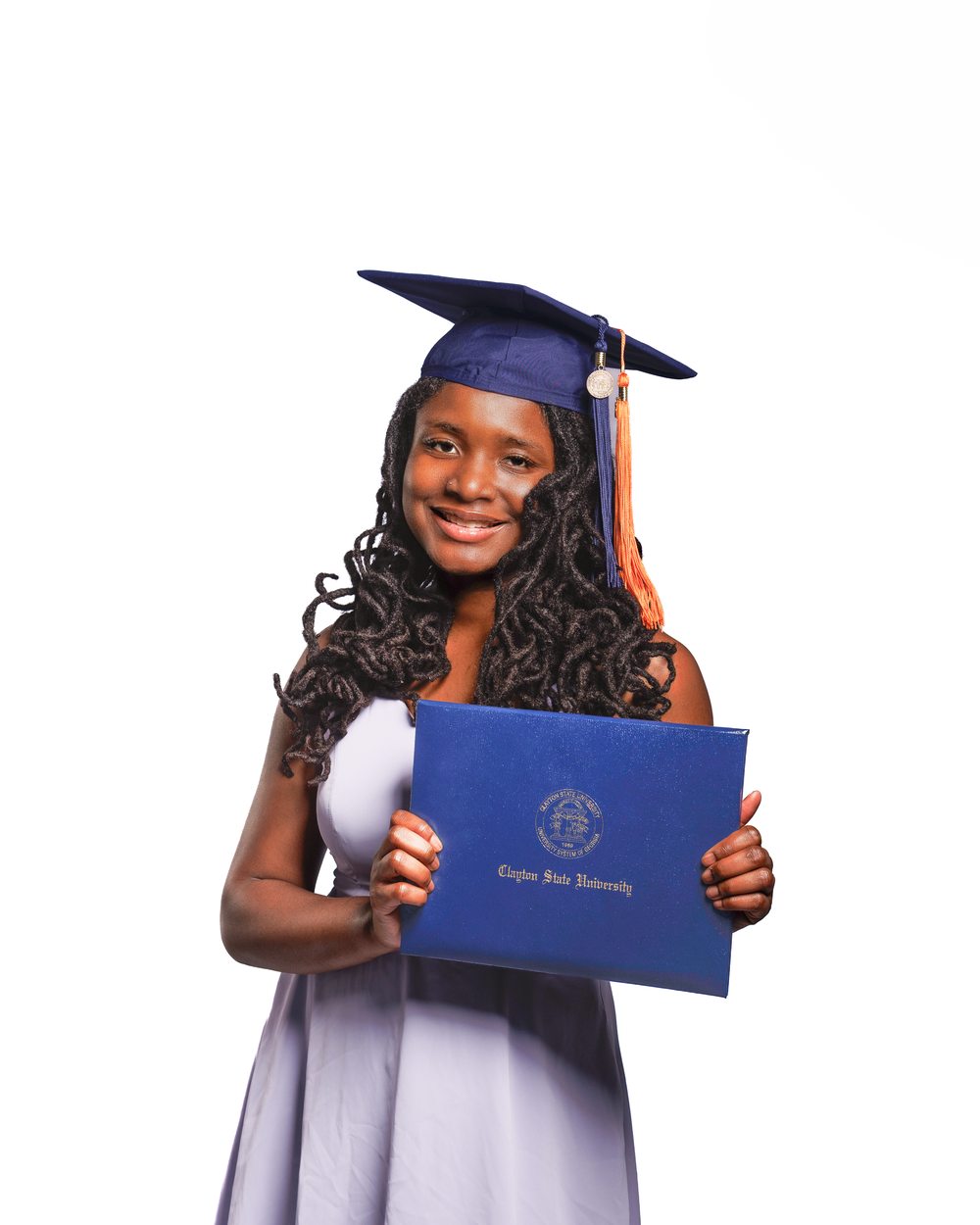 Graduate smiling and holding diploma