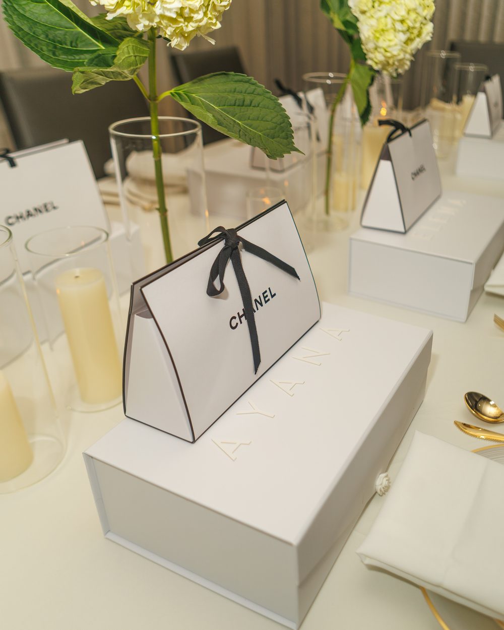 Personalized Chanel gift box place setting at a bridesmaids dinner