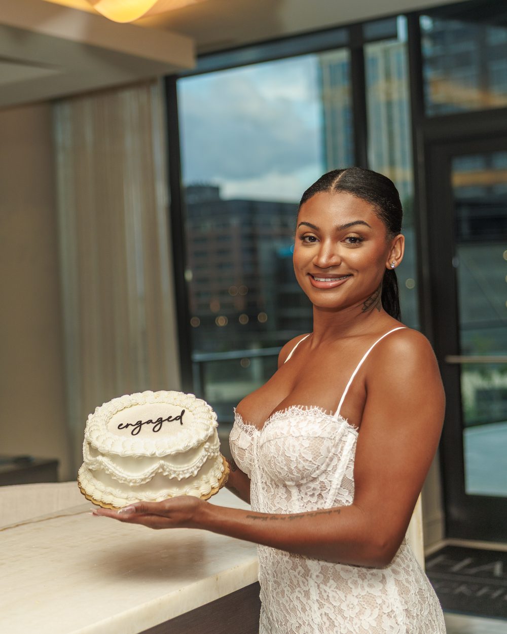 Engagement celebration cake with engaged script topper